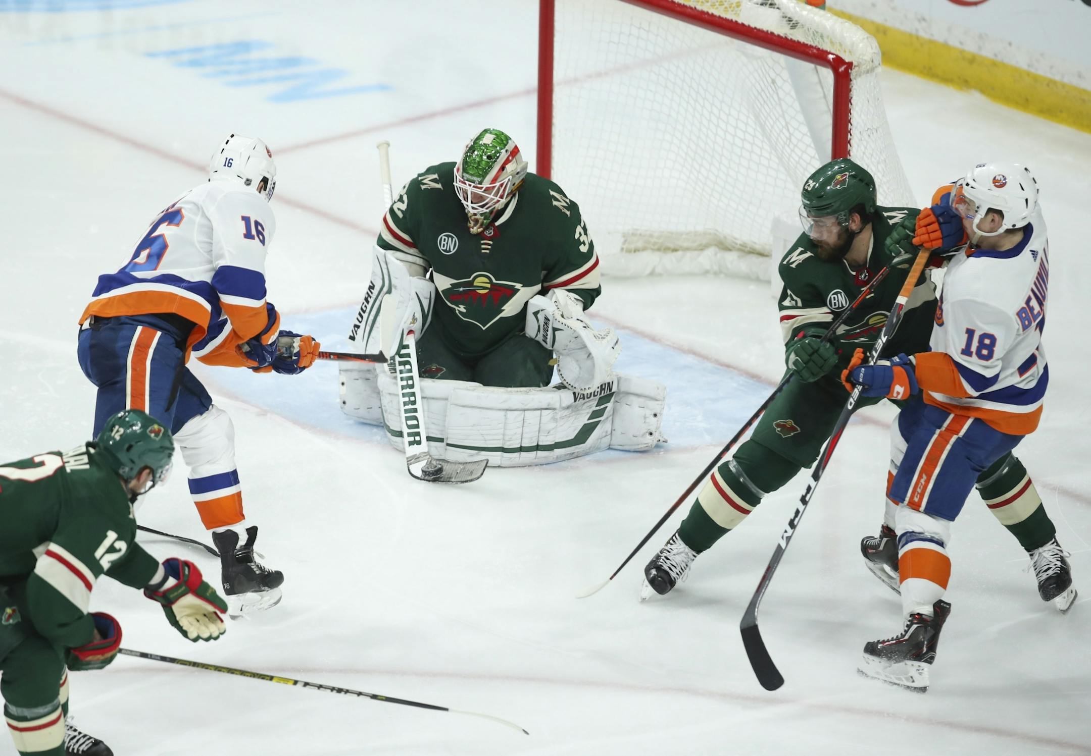 Minnesota Wild goaltender Alex Stalock (32) stopped a third period shot by New York Islanders left wing Andrew Ladd (16).