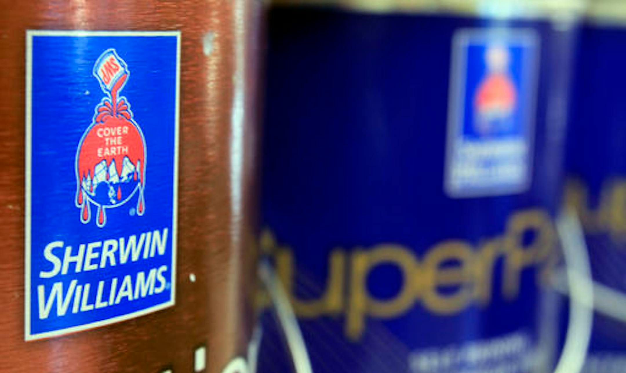 FILE - In this Oct. 20, 2010, file photo, cans of paint are seen at a Sherwin Williams store in Brunswick, Maine. Paint company Sherwin-Williams is buying rival Valspar for $11.3 billion in a move that it says will expand its reach in Asia and Europe. (AP Photo/Pat Wellenbach, File)