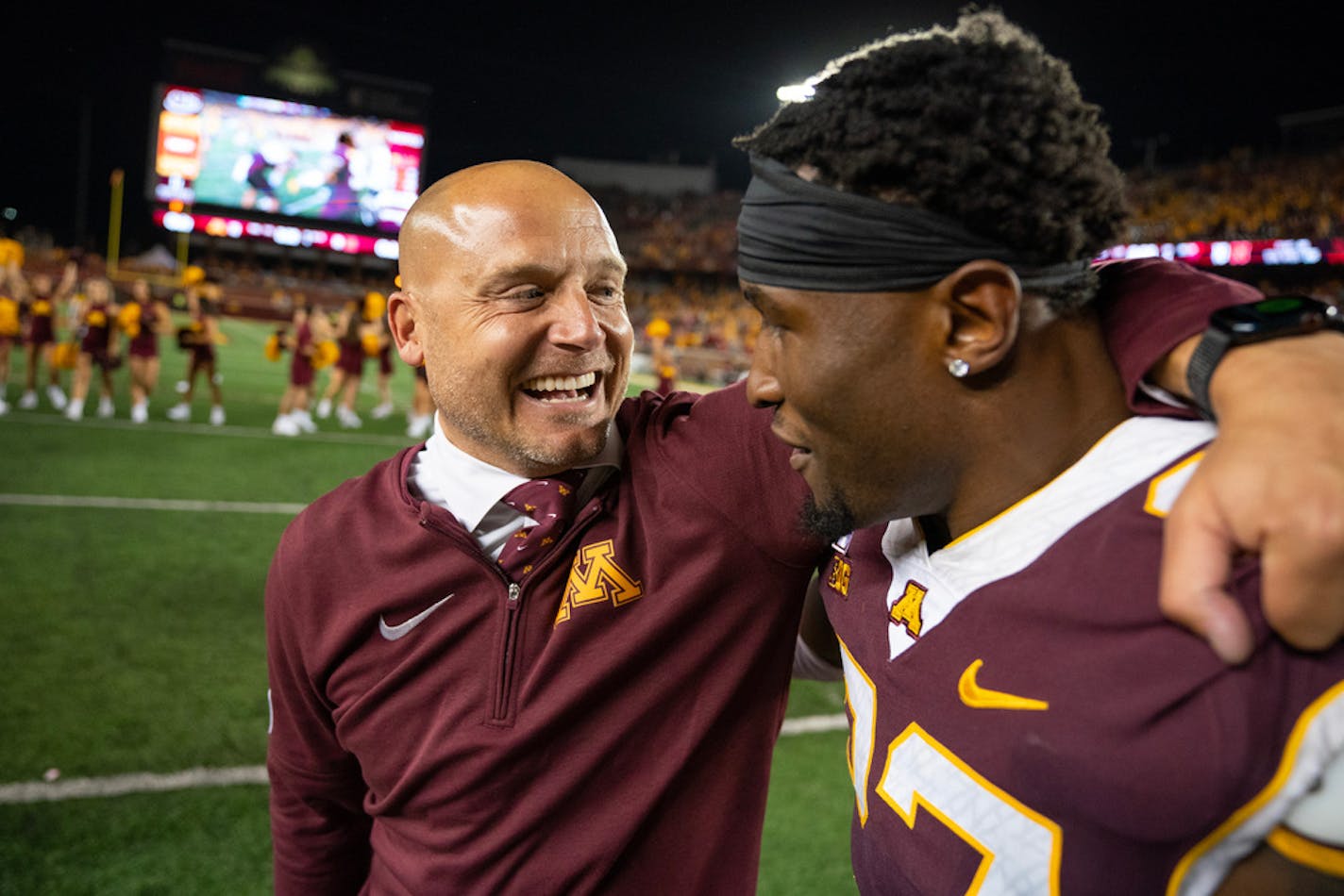 Minnesota Gophers head coach P.J. Fleck embraces Minnesota Gophers defensive back Tyler Nubin (27) after defeating Nebraska 13-10 Thursday, Aug. 31, 2023, at Huntington Bank Stadium in Minneapolis, Minn. ]