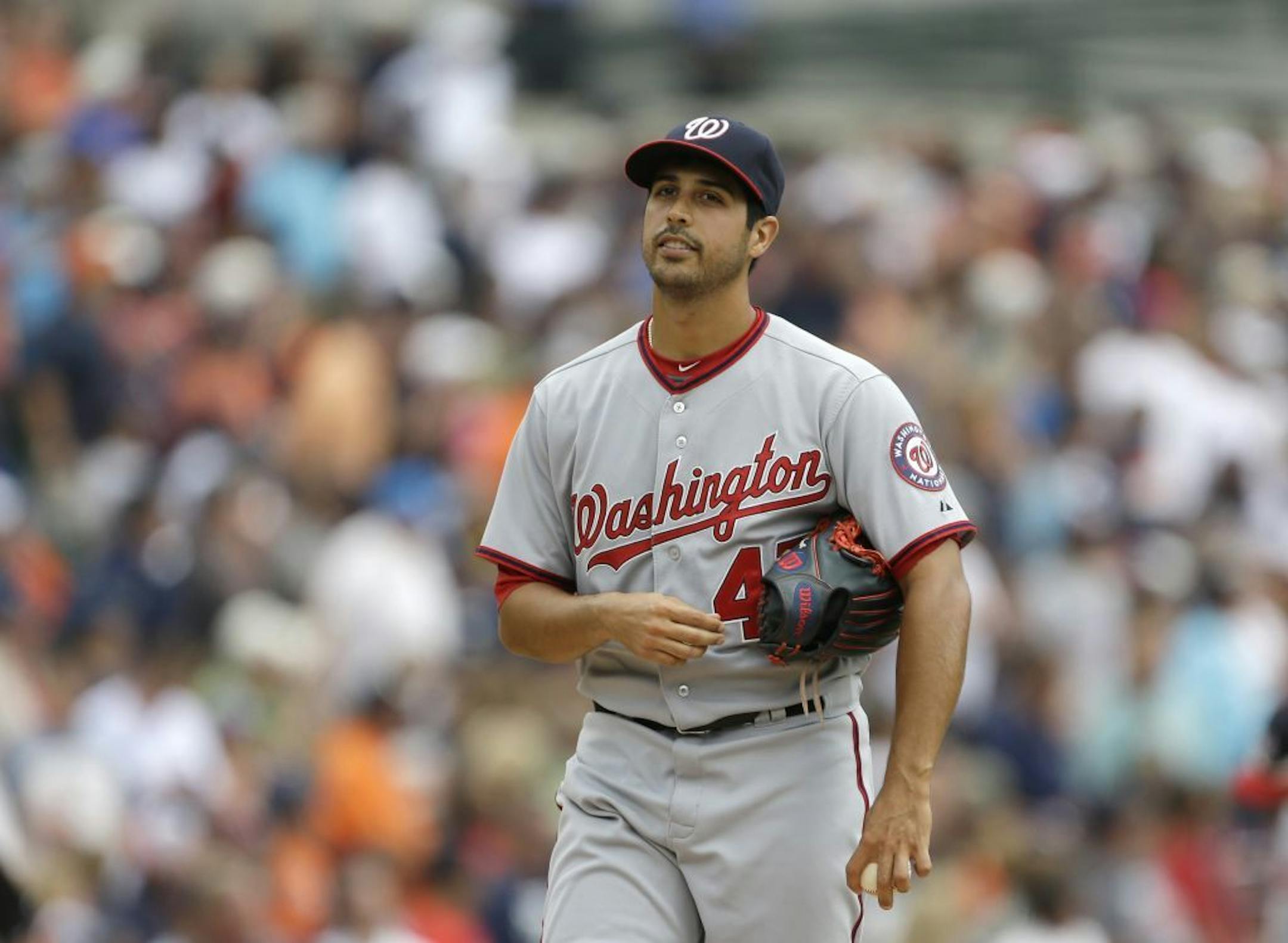 Washington Nationals starting pitcher Gio Gonzalez stands on the mound after giving up five runs to the Detroit Tigers during the second inning of a baseball game in Detroit, Wednesday, July 31, 2013.