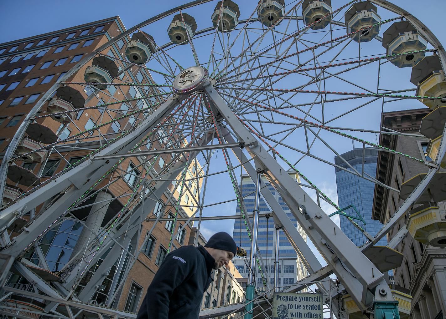 Tim Leininger, cq, made his way to and from a giant Ferris wheel where he was placing signage in preparation for the Final Four festivities, Wednesday, April 3, 2019 in Minneapolis, MN. There will be a four-day tailgate on Nicollet Mall and the wheel is one of the attractions added to wow out-of-town guests. ] ELIZABETH FLORES &#x2022; liz.flores@startribune.com