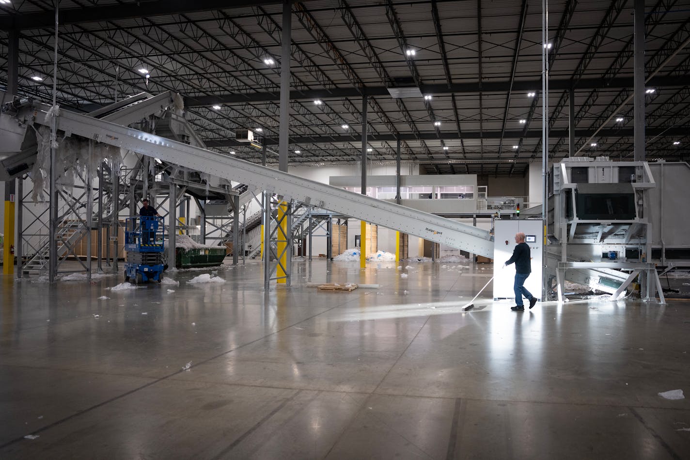 Employees work inside the Myplas USA plastic recycling facility in Rogers, Minn., on Tuesday, Dec. 12, 2023.