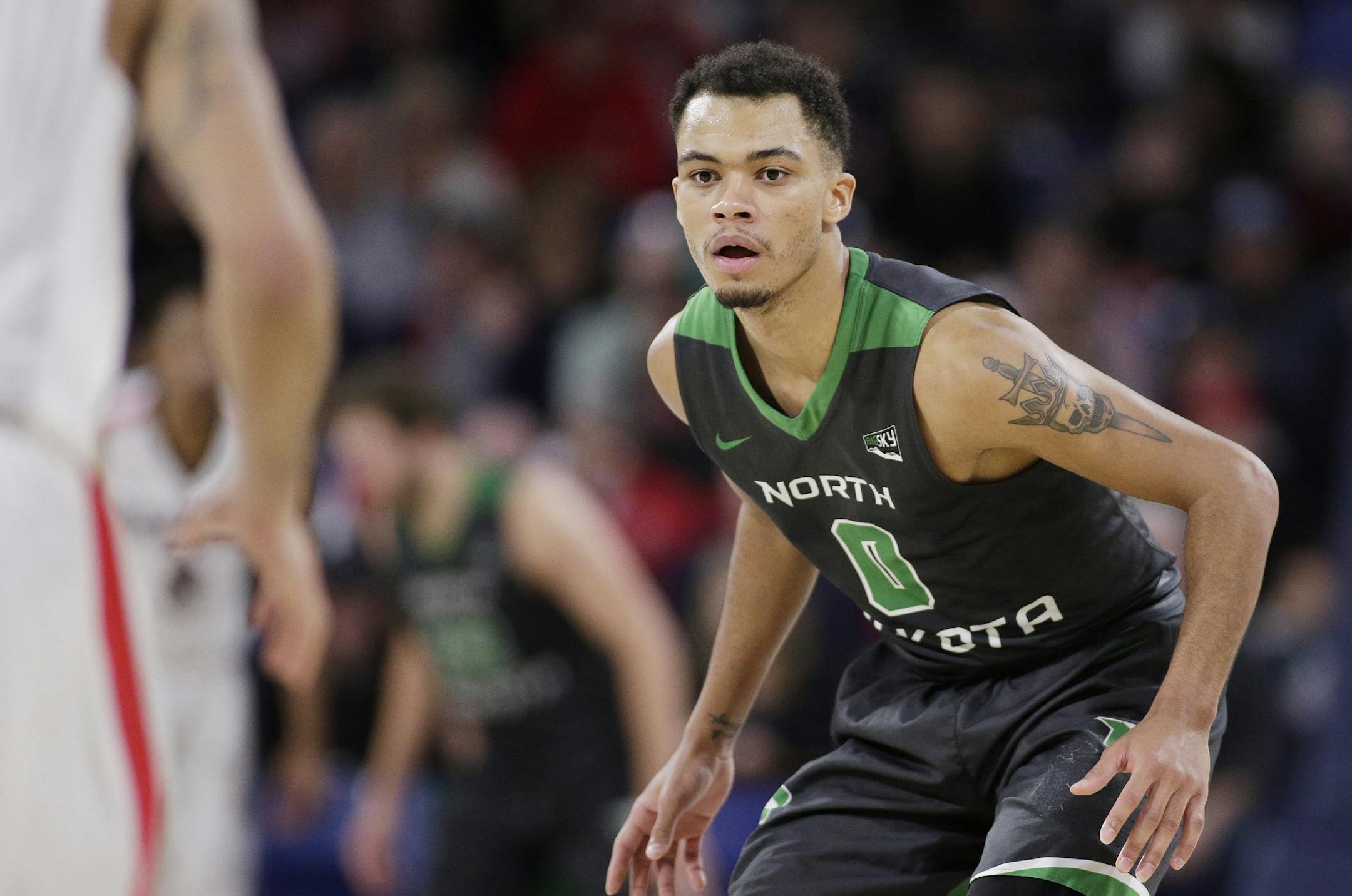 North Dakota guard Geno Crandall (0) prepares to defend during the second half of an NCAA college basketball game against Gonzaga in Spokane, Wash., Saturday, Dec. 16, 2017. (AP Photo/Young Kwak) ORG XMIT: OTK