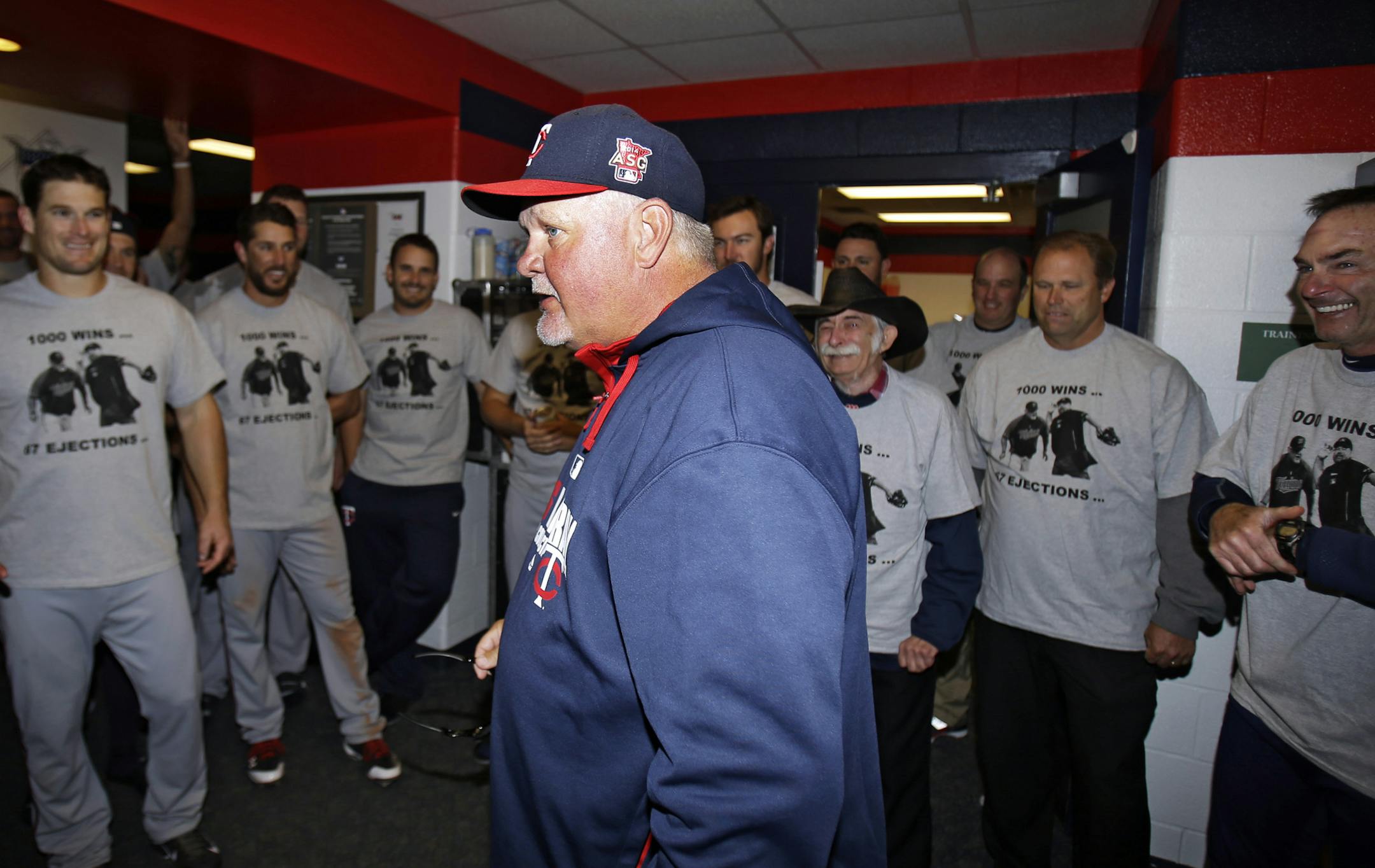 Minnesota Twins manager Ron Gardenhire talks with his team in the locker room after the Twins defeated the Cleveland Indians 7-3 in a baseball game, Saturday, April 5, 2014, in Cleveland. The Twins win Saturday gave Gardenhire his 1,000th career victory. (AP Photo/Tony Dejak)