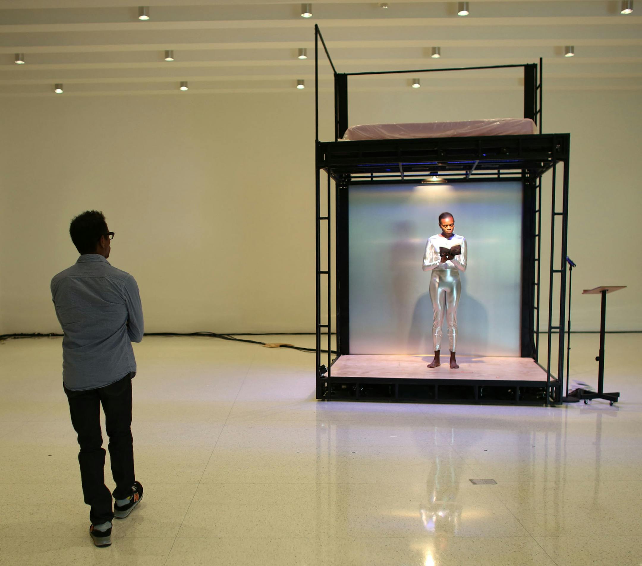Ralph Lemon walked around the space a watched as Okwui Okpokwasili read from "Tides of Lust" by Samuel R. Delany during rehearsal. ] (KYNDELL HARKNESS/STAR TRIBUNE) kyndell.harkness@startribune.com at the Walker Arts Center in Minneapolis Min., Thursday, September 18, 2014.
