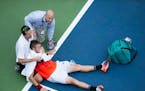 Jack Sock is forced to retire due to cramping and heat exhaustion during his second-round men's singles match against Ruben Bemelmans in the U.S. Open