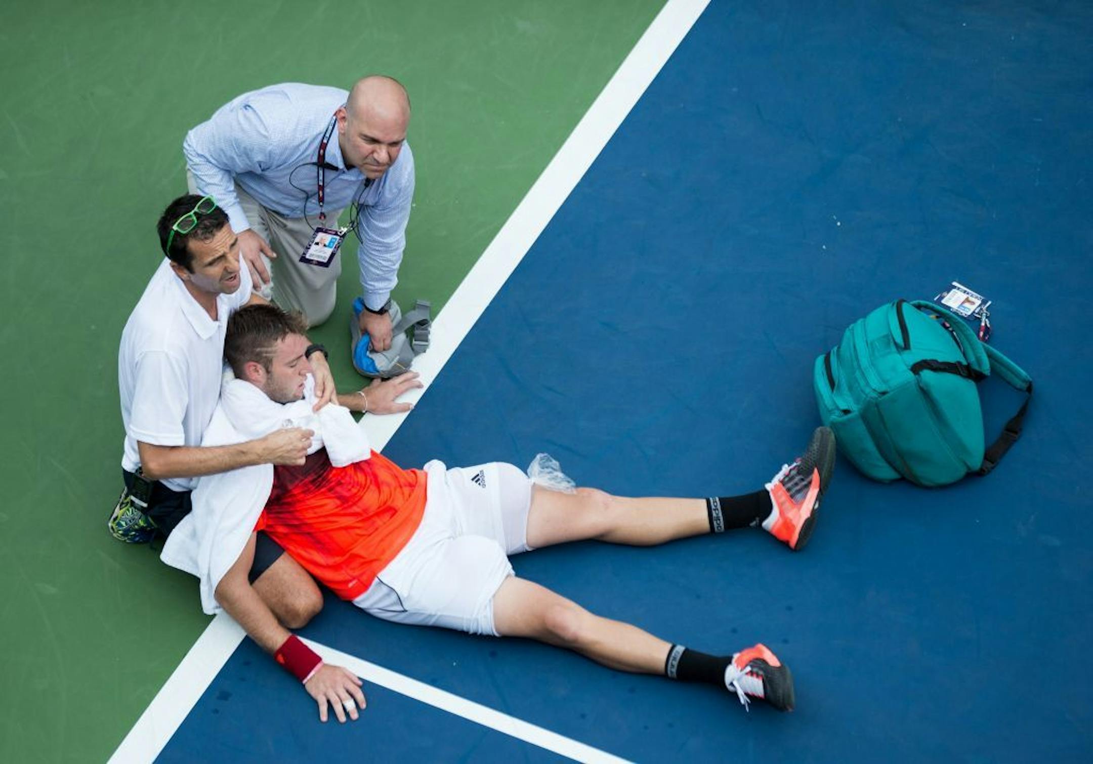Jack Sock is forced to retire due to cramping and heat exhaustion during his second-round men's singles match against Ruben Bemelmans in the U.S. Open at the Billie Jean King National Tennis Center in Flushing Meadows, New York, on Thursday, Sept. 3, 2015.