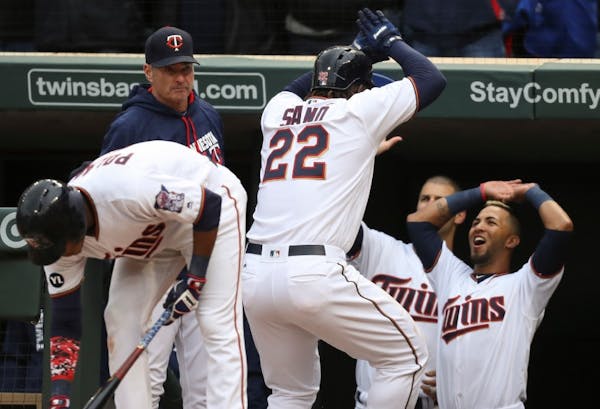 Miguel Sano returned to the Twins dugout after hitting a home run into the second deck on Opening Day.