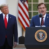 FILE - In this March 30, 2020 file photo, My Pillow CEO Mike Lindell speaks as President Donald Trump listens during a briefing about the coronavirus in the Rose Garden of the White House, in Washington. Lindell, is weighing a run for governor in Minnesota. If he follows through on a campaign, it could be an early test of where the Republican Party is headed in the post-Donald Trump era. (AP Photo/Alex Brandon, File) ORG XMIT: MER91a39036b4955bca39a2324a7a8a6