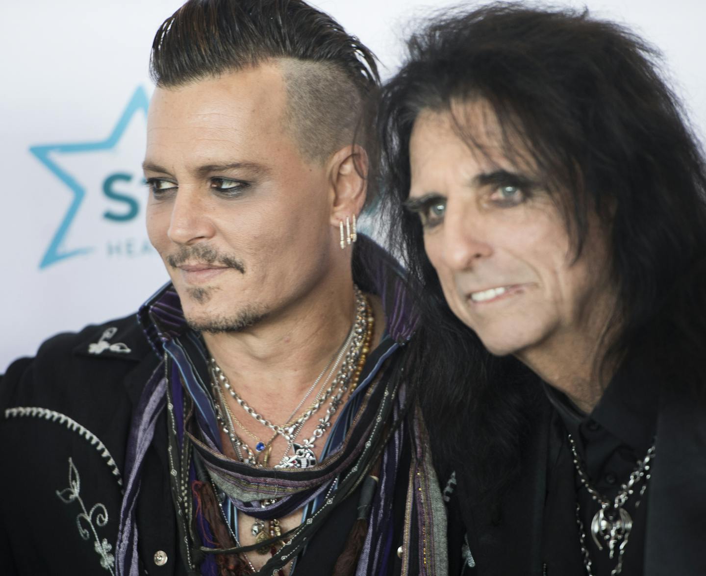 Actor Johnny Depp stood with Alice Cooper on the Starkey Gala red carpet at the River Centre in St. Paul on Sunday afternoon.