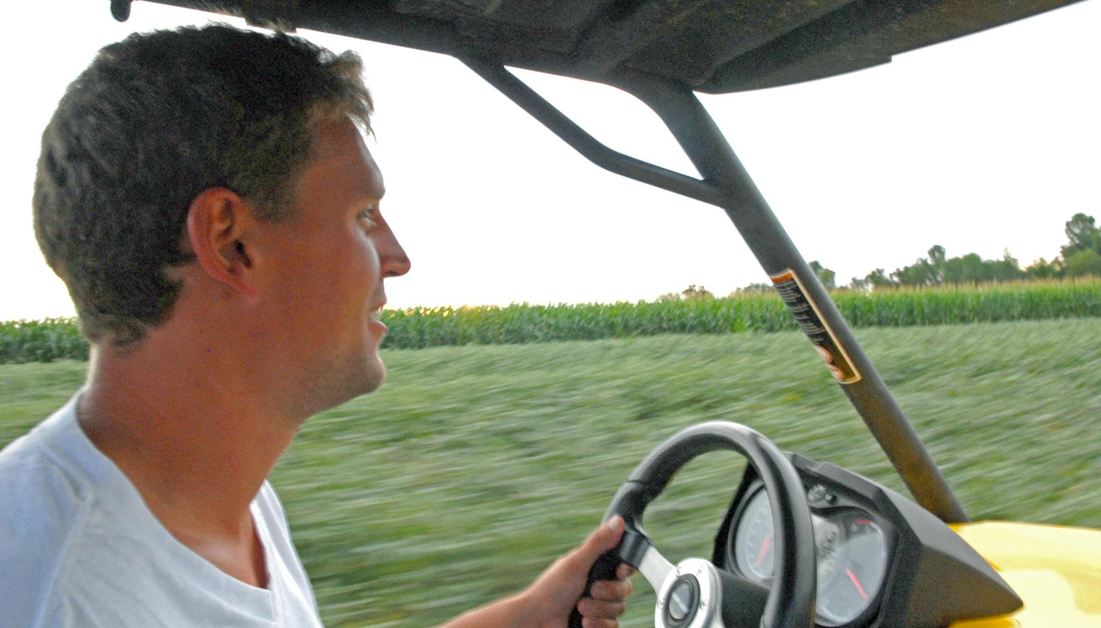 Nathaniel "Sonny'' Peterson on his family's farm between North Branch and Taylors Falls, Minn. The Petersons practice no-till planting, and alternate their soybeans (near background) and corn to conserve soil nutrients and reduce water runoff from the fields.