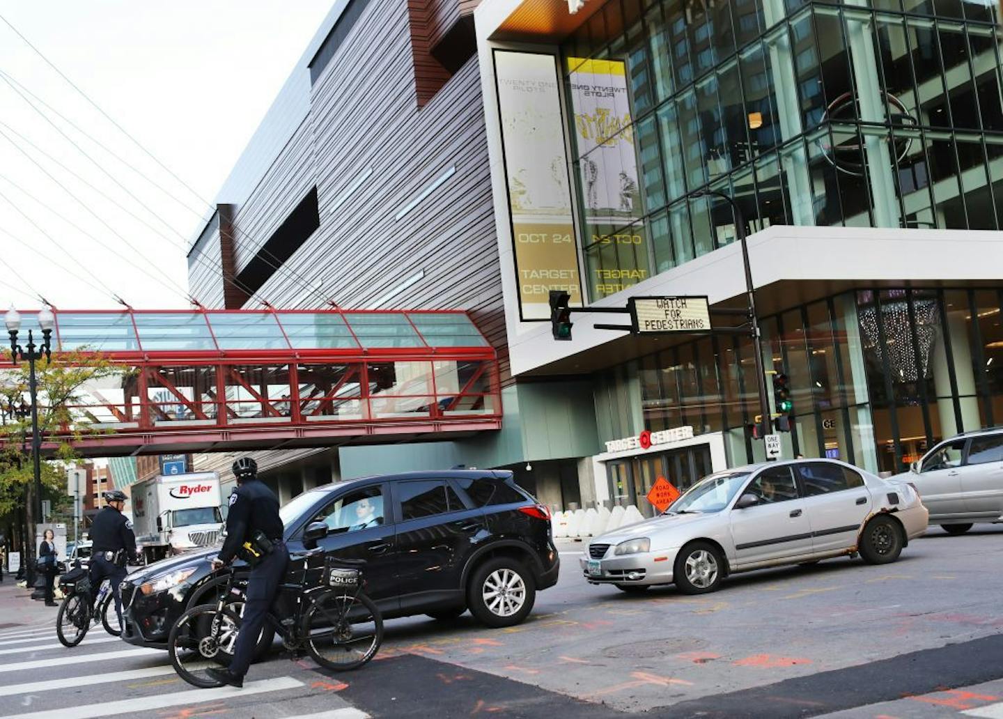 Minneapolis police officers on bikes dealt with traffic outside Target Center on Wednesday, a day before President Donald Trump's rally there.