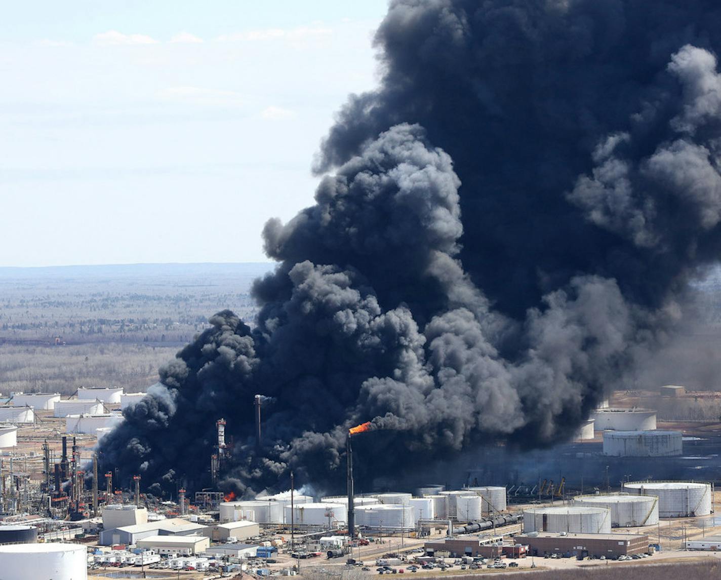 042718.N.DNT.REFINERYFIREc13 -- Thick smoke pours from the fire at the Husky Enery oil refinery in Superior, Wis. Thursday afternoon. Bob King / rking@duluthnews.com