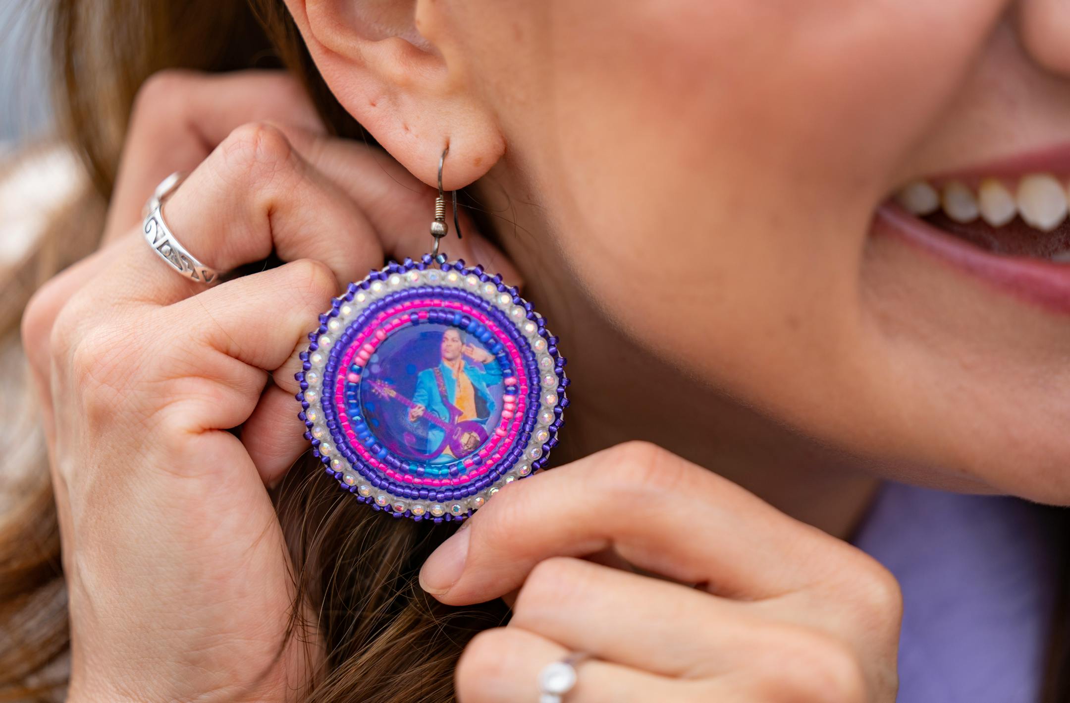 Minnesota Lieutenant Governor Peggy Flanagan shows off her Prince earrings.