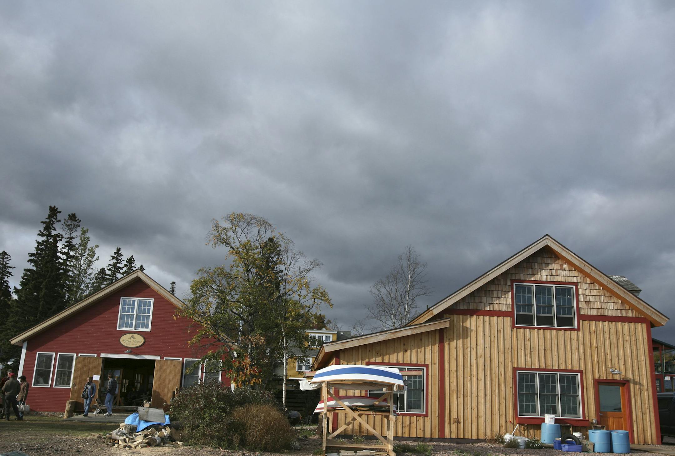 The campus of North House Folk School, Grand Marais, Minn. The woodshop (left) is an old Forest Service Building. The "Fish House" (right) was made by North House volunteers after the original fish house was destroyed by a runaway truck. // See article Sunday January 28, 2007, Star Tribune, page G1. // culture and traditions //