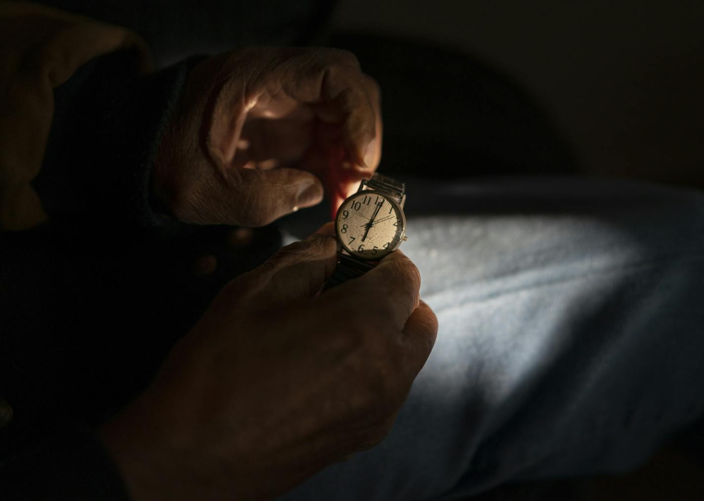 Cornelius Martin wound his watch up as he waited to go to the dentist. Martin, 86, has dementia and he lives in is home of 57 years in south Minneapolis. His four kids, sons Tony Martin, Craig Martin, and his twin daughters Kelly Martin and Karen Martin are tag-teaming to keep their father in his home.