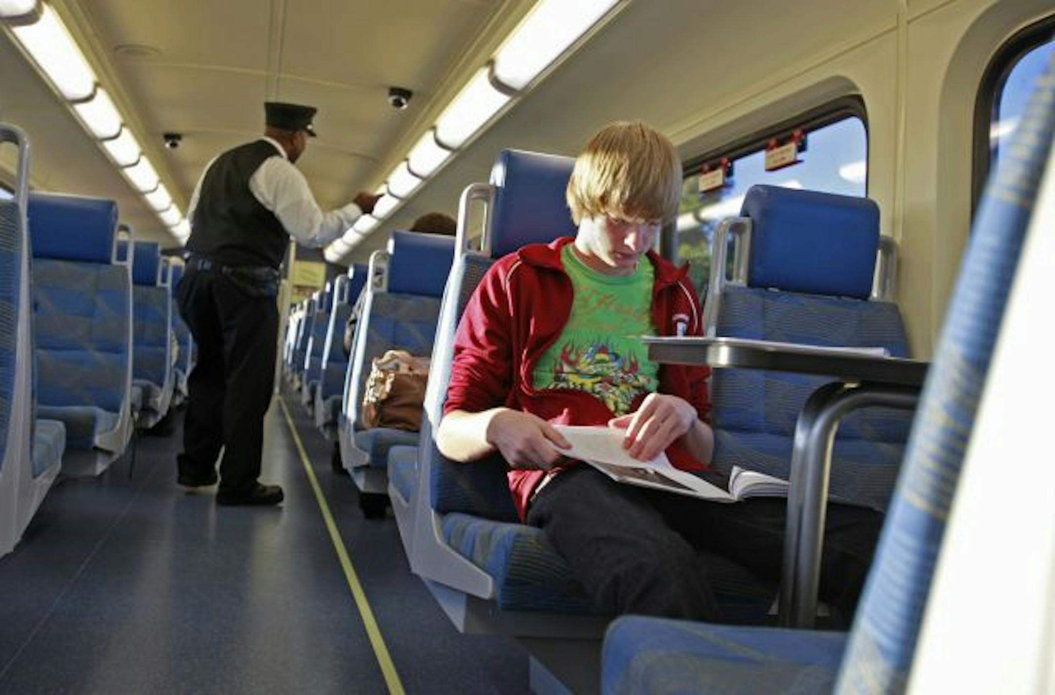 MTS High School student Kevin Burnham, 16, of Big Lake works on his forensics science homework while on his way to school in Minneapolis.
