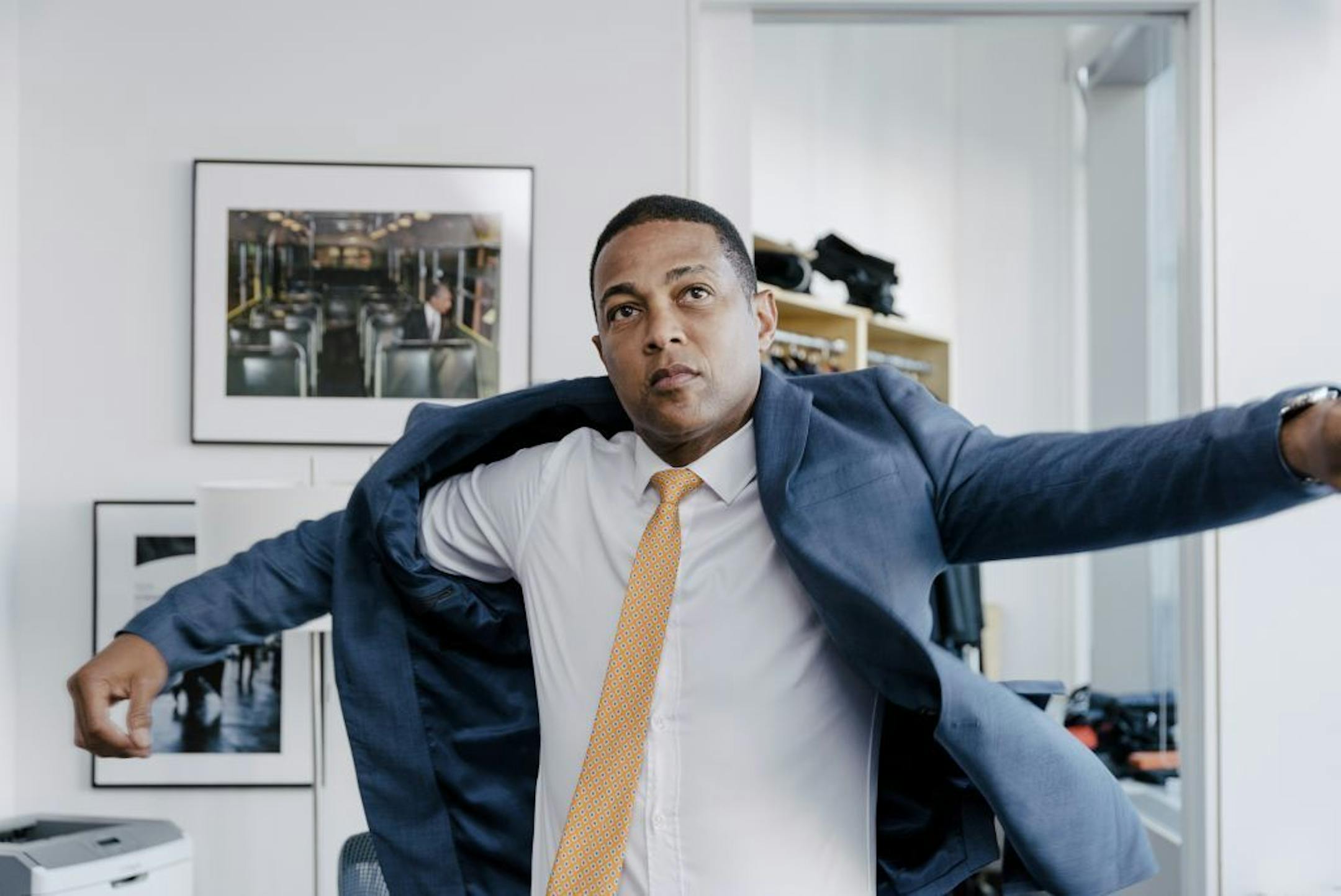 Don Lemon, host of "CNN Tonight" dresses in his office at the Time Warner Building in New York, June 20, 2017. Lemon is under the bright CNN lights some 260 nights a year. So he has his grooming routine down to a science.