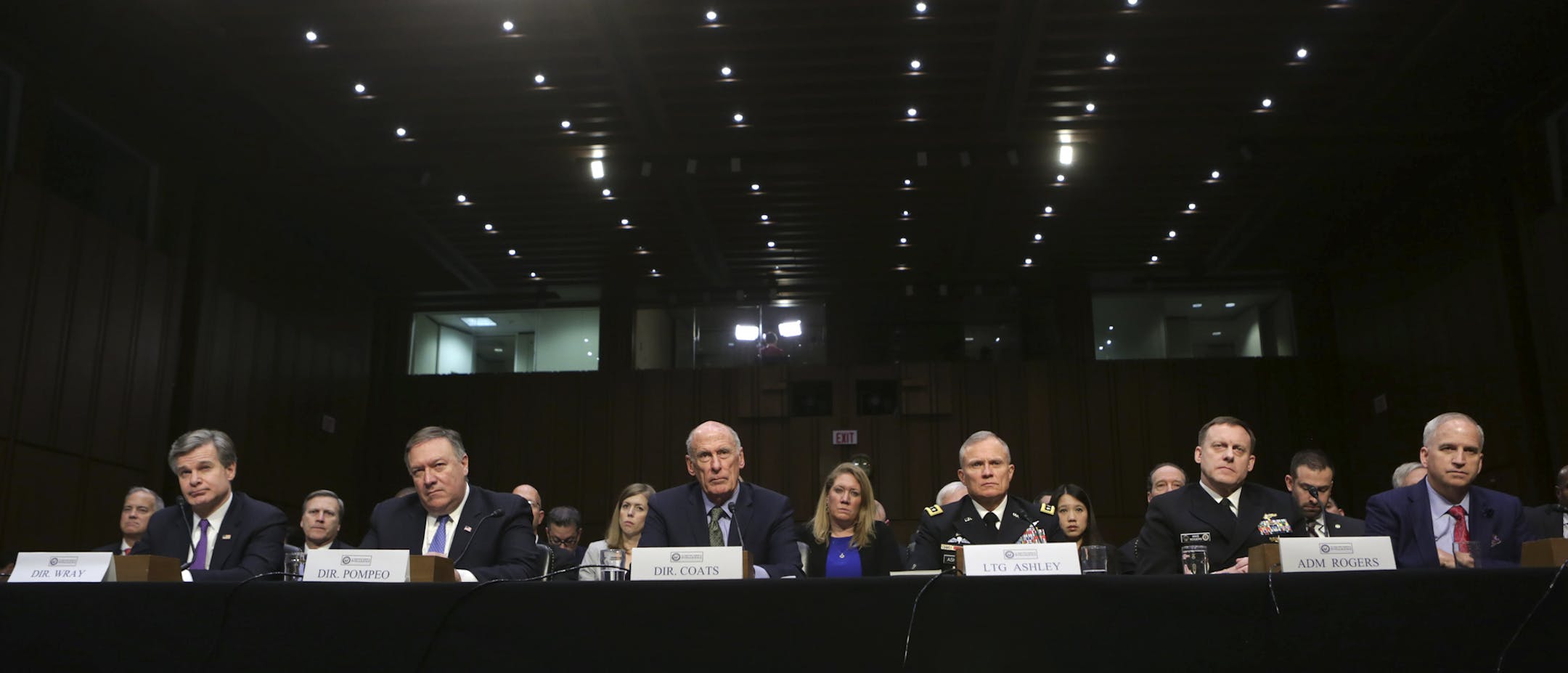 American intelligence and law enforcement officials testify about worldwide threats held by the Senate Intelligence Committee on Capitol Hill, in Washington, Feb. 13, 2018. From left: Chris Wray; director of the FBI, Michael Pompeo; director of the Central Intelligence Agency, Dan Coats; director of National Intelligence, Lt. General Robert Ashley; director of the Defense Intelligence Agency, Adm. Michael Rogers; director of the National Security Agency, and Robert Cardillo; director of the Nati