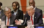 United States President Donald Trump, right, speaks while United Nations Secretary-General Antonio Guterres listens at a meeting during the United Nat