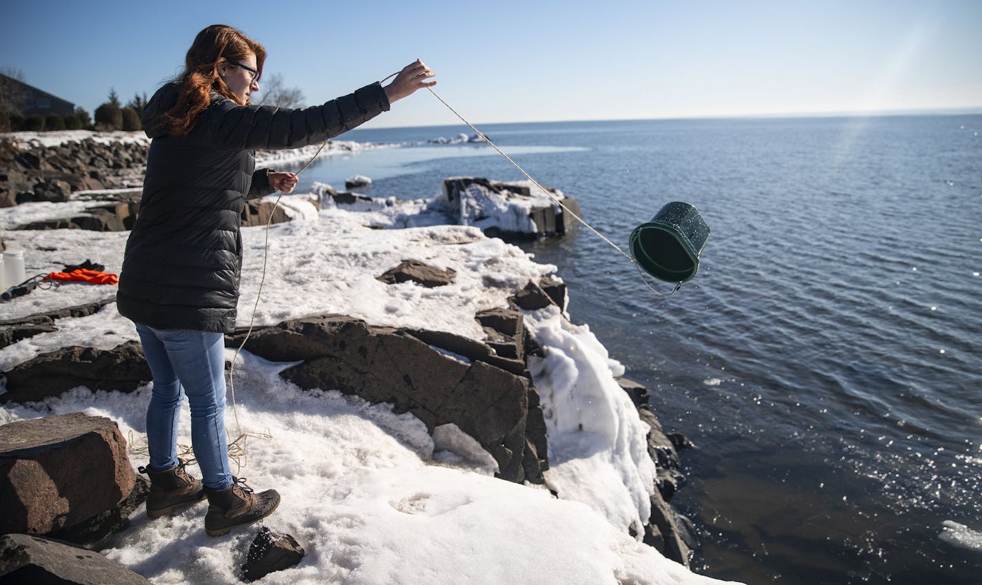 Katie Cassidy, a masters student in water resources science, threw a bucket in Lake Superior to retrieve a water sample on Monday morning. ]
ALEX KORMANN &#x2022; alex.kormann@startribune.com University of Minnesota Duluth researchers are partnering with the DOT and DNR to look at chemicals that could be more environmentally friendly and effective than salt when treating winter roads. Researchers went out testing water runoff in Lake Superior and along Tischer Creek in Duluth, MN on Monday Febru