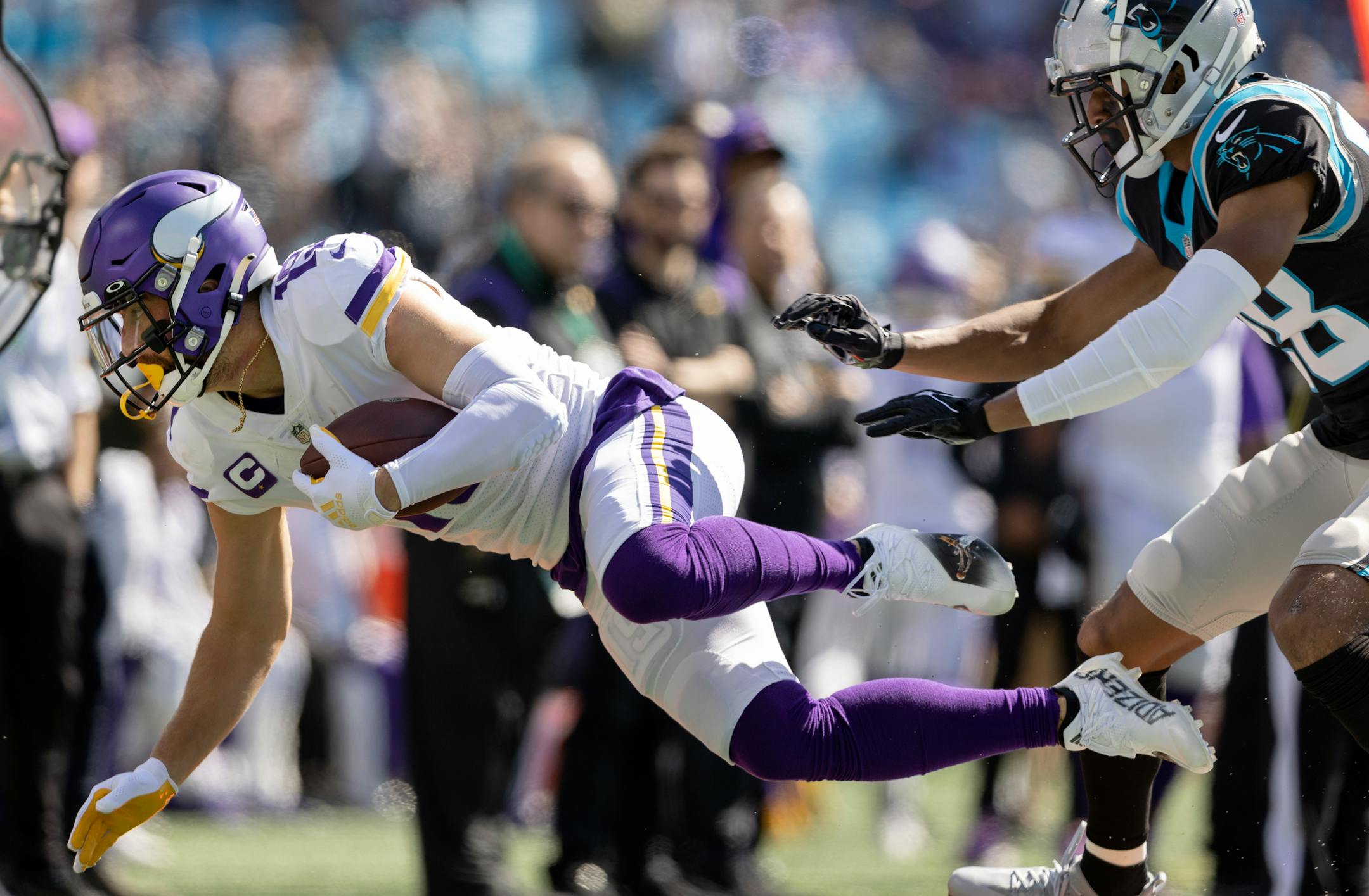 Minnesota Vikings receiver Adam Thielen (19) pushed out of bounds by Keith Taylor Jr. (28) of the Carolina Panthers in the first quarter.