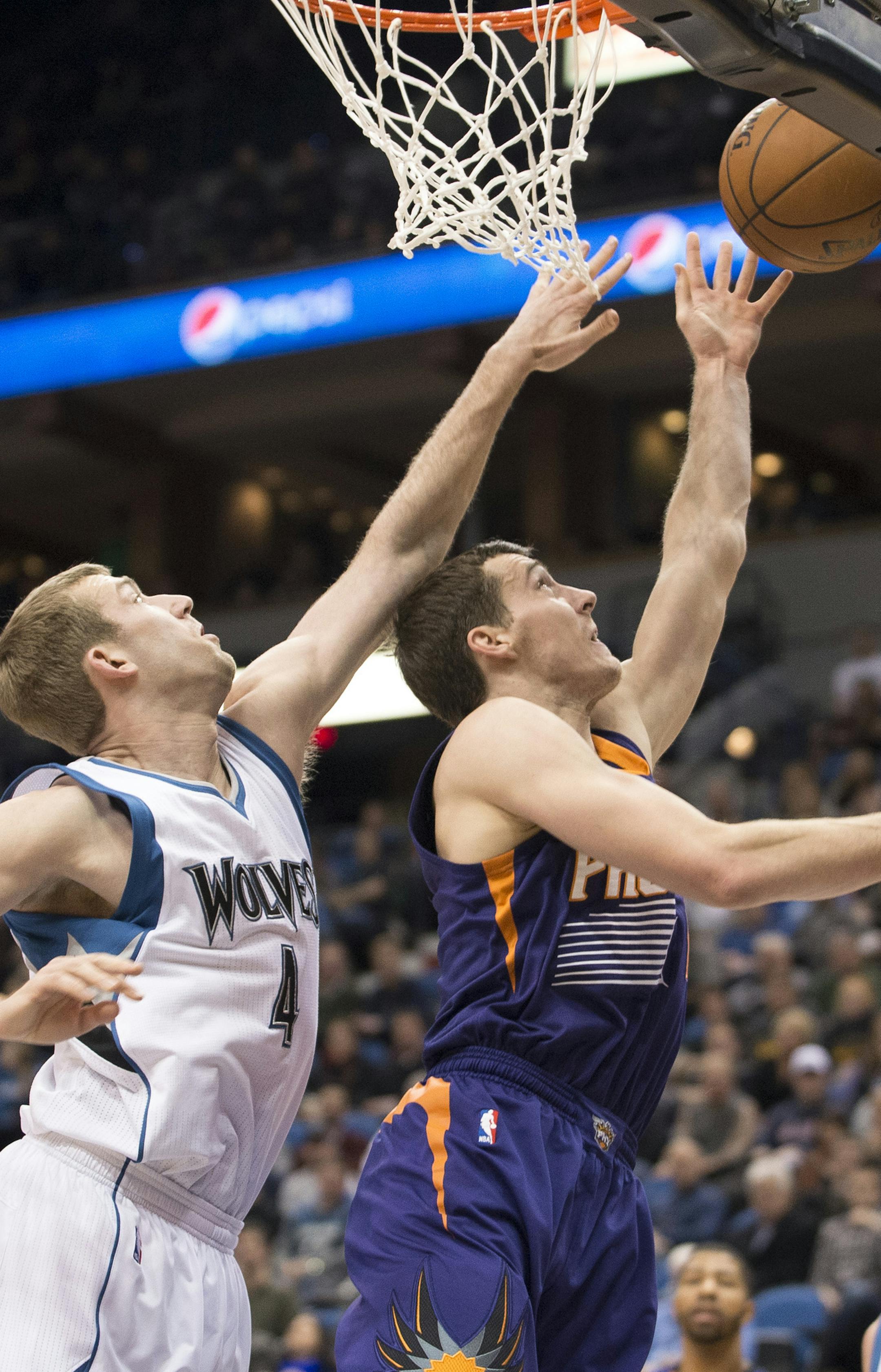 Phoenix Suns guard Goran Dragic (1) gets a layup while being defended by Minnesota Timberwolves forward Robbie Hummel (4) during the second quarter. ] (Aaron Lavinsky | StarTribune) The Minnesota Timberwolves play the Phoenix Suns Wednesday, Jan. 7, 2014 at Target Center in Minneapolis.