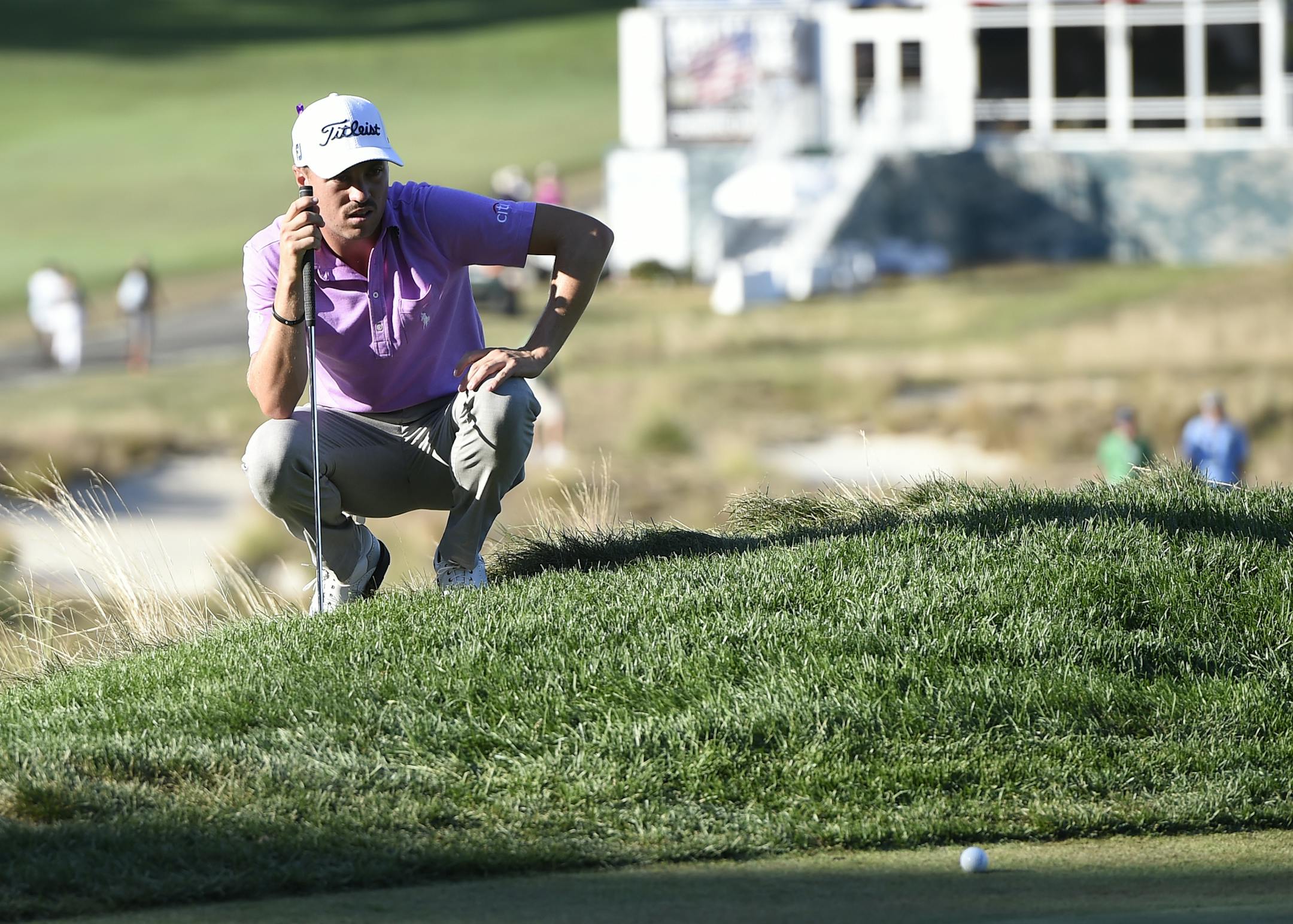 Justin Thomas lines up his putt on the 18th green during the final round of The Barclays golf tournament in Farmingdale, N.Y., Sunday, Aug. 28, 2016. (AP Photo/Kathy Kmonicek)