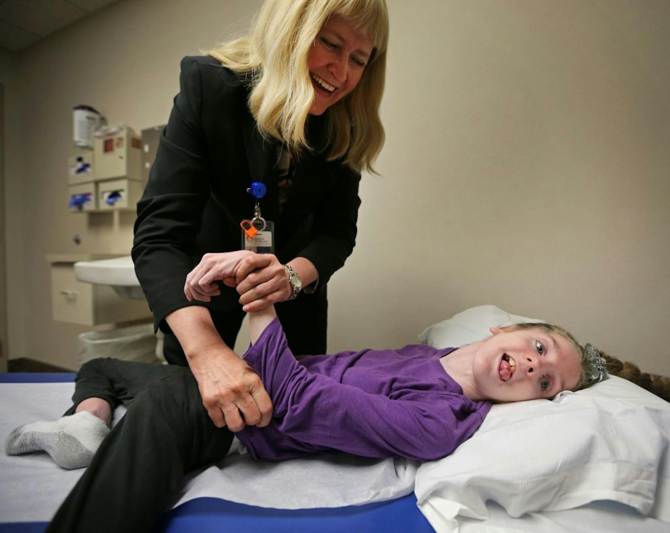 Orthopedic surgeon Dr. Deborah Quanbeck examines 11-year old Lily Harris at Gillette Children's Hospital in St. Paul. Dr. Quanbeck has been a part of Lily's medical care team since Lily was a baby.