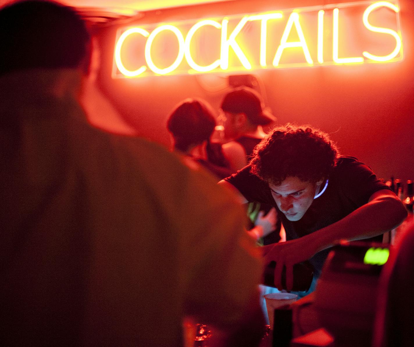 Bartenders serve up drinks in the mezzanine bar at the Skyway Lounge in downtown Minneapolis on Oct. 4, 2013. Photo by Leslie Plesser.