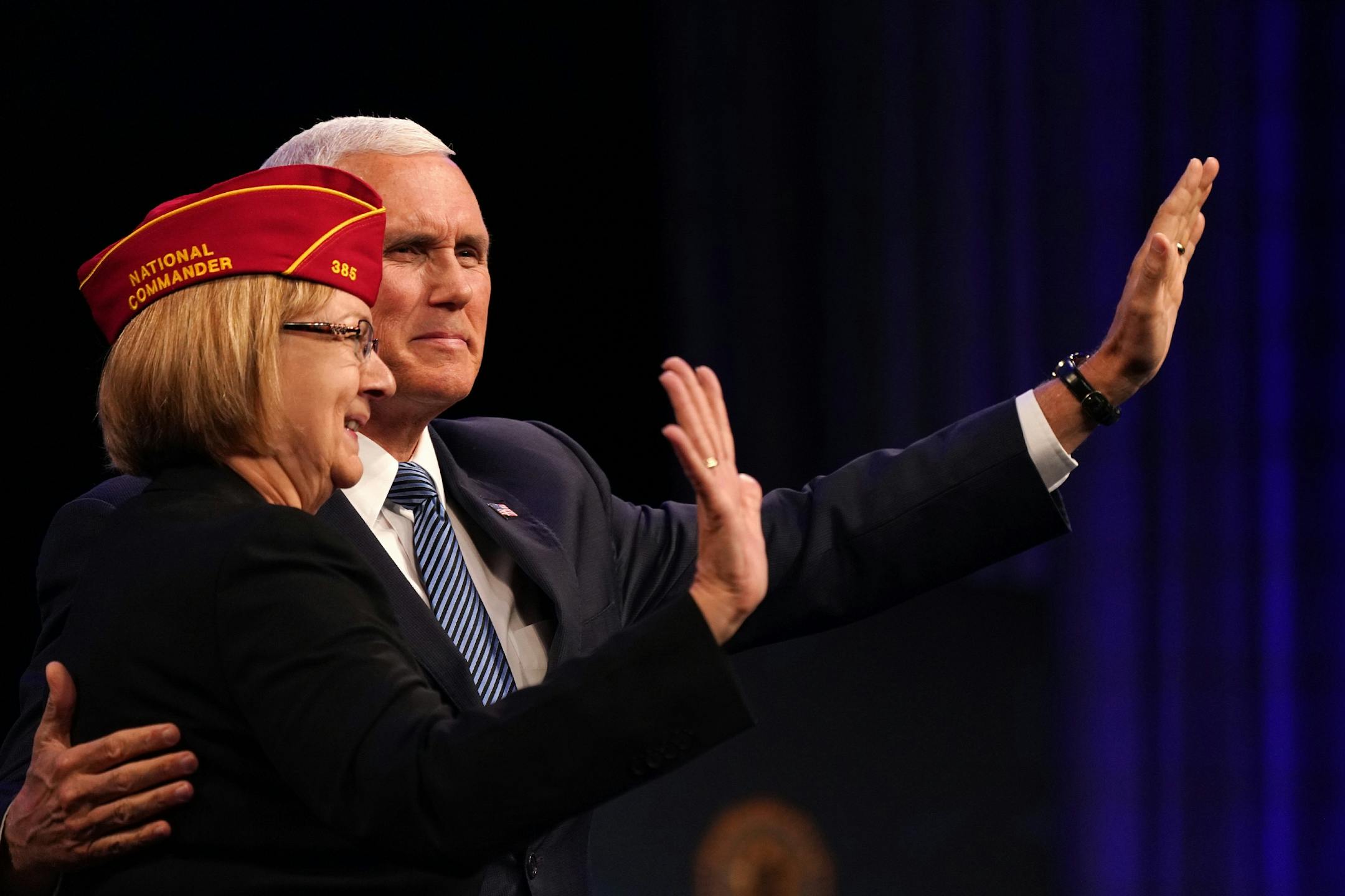 Vice President Mike Pence waved along with outgoing national commander of the National Legion Denise Rohan to attendees of the American Legion National Convention before he spoke Thursday.