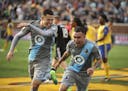 Back when they were teammates: Christian "Superman" Ramirez (left) helped Miguel "Batman" Ibarra celebrate a goal during a Minnesota United game in 20