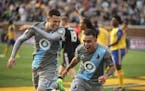 Back when they were teammates: Christian "Superman" Ramirez (left) helped Miguel "Batman" Ibarra celebrate a goal during a Minnesota United game in 20