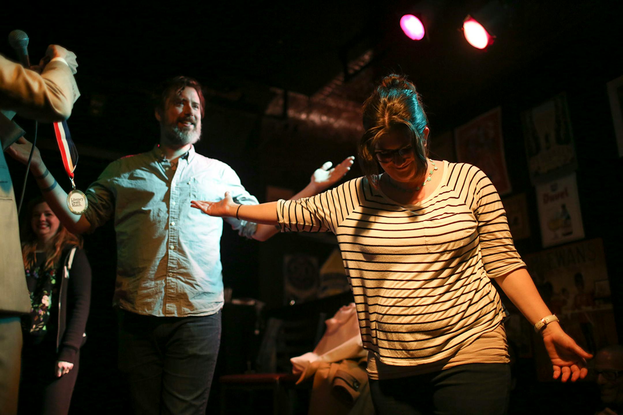 Mark Doten prevailed in a championship round of literary charades to win the Literary Death Match over the other finalist, Claire Vaye Watkins, right, Wednesday night at Nomad World Pub. ] JEFF WHEELER ï jeff.wheeler@startribune.com One of the off-site events at the start of the AWP Conference & Bookfair was the Literary Death Match Wednesday night, April 8, 2015 at Nomad World Pub in Minneapolis. Four writers read their work and were judged by a panel of three all star judges.