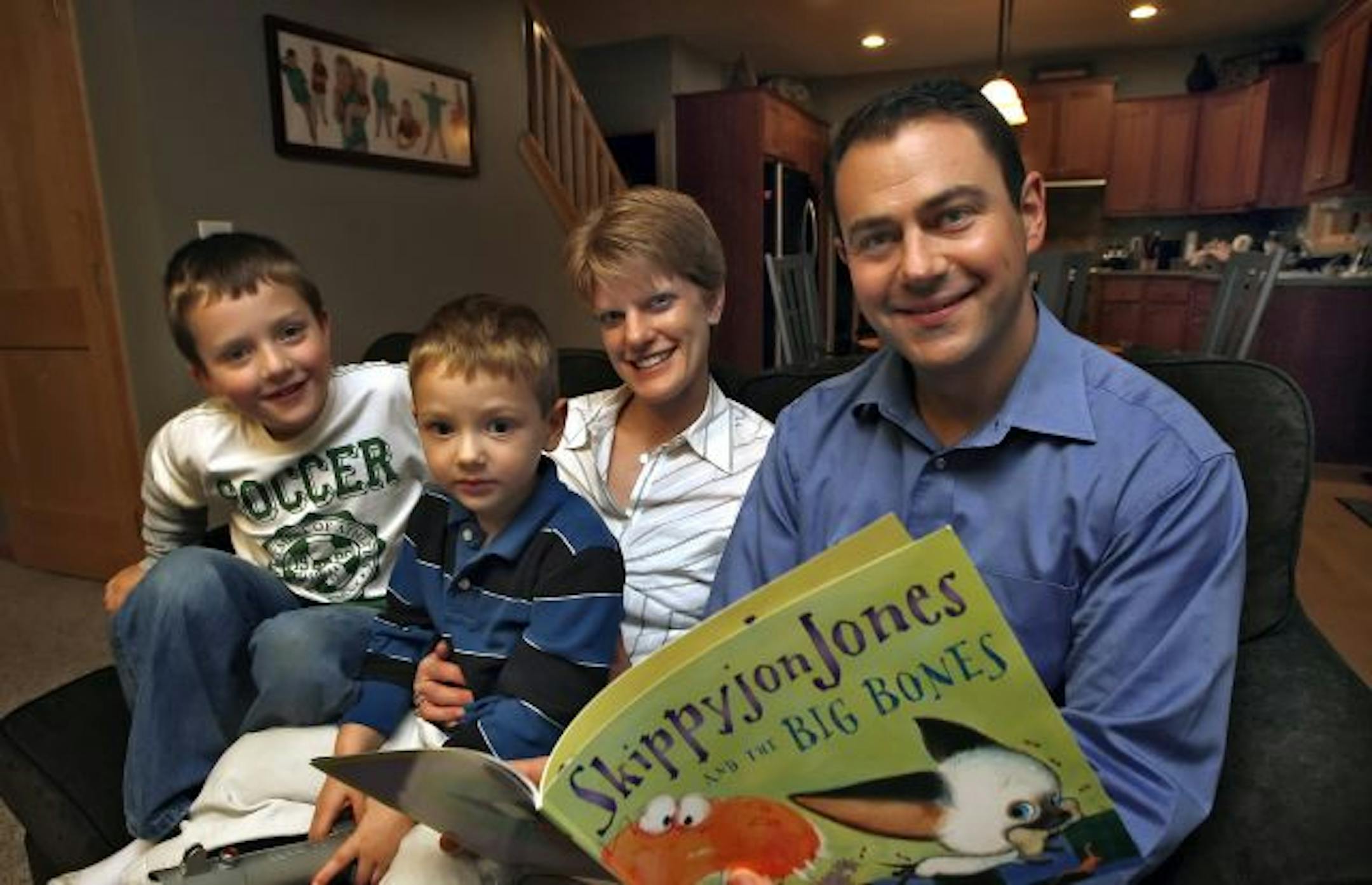 Pediatrician Sonja Tarrago with her husband, Rod, and boys Braden, 6, left, and Ian, 4.