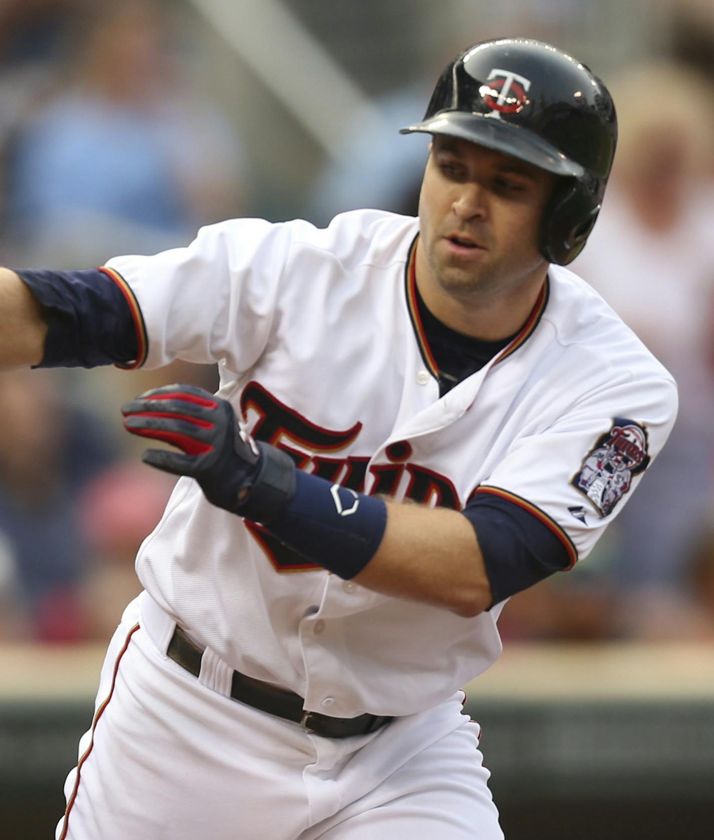 Minnesota Twins second baseman Brian Dozier headed to first after drawing a walk in the first inning Thursday night at Target Field. JEFF WHEELER &#xef; jeff.wheeler@startribune.com The Twins began a series with the Detroit Tigers Thursday night, July 9, 2015 at Target Field in Minneapolis.