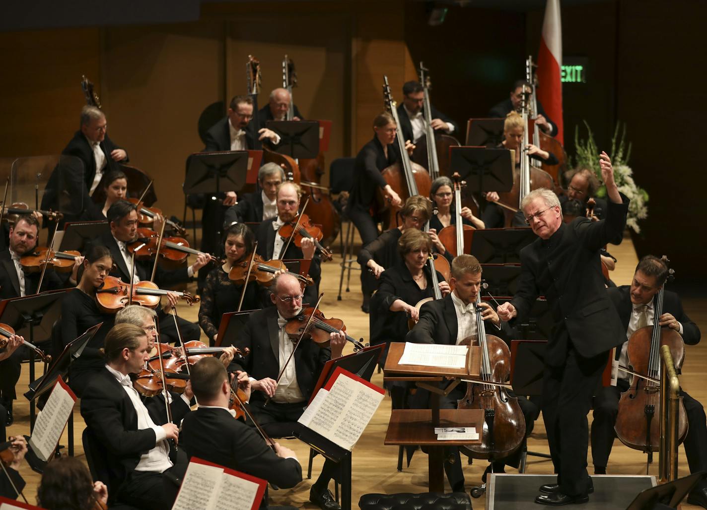 Minnesota Orchestra Music Director Osmo V&#x2030;nsk&#x2030; conducted the orchestra performing "Adagio," from Symphony No. 7 by Anton Bruckner. Long associated with Stanislaw Skrowaczewski, he first heard Bruckner's Symphony No. 7 coming from a window as a young boy and it moved him so deeply he fainted. The flag of Skrowaczewski's native Poland was onstage at rear. ] JEFF WHEELER &#xef; jeff.wheeler@startribune.com The Minnesota Orchestra memorialized their Conductor Laureate, Stanislaw Skrowa