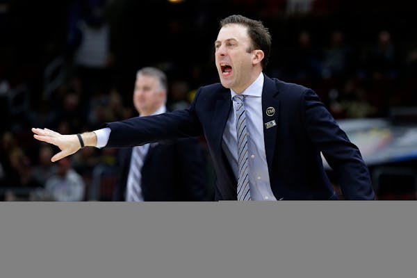Minnesota head coach Richard Pitino directs his team during the first half against Purdue.