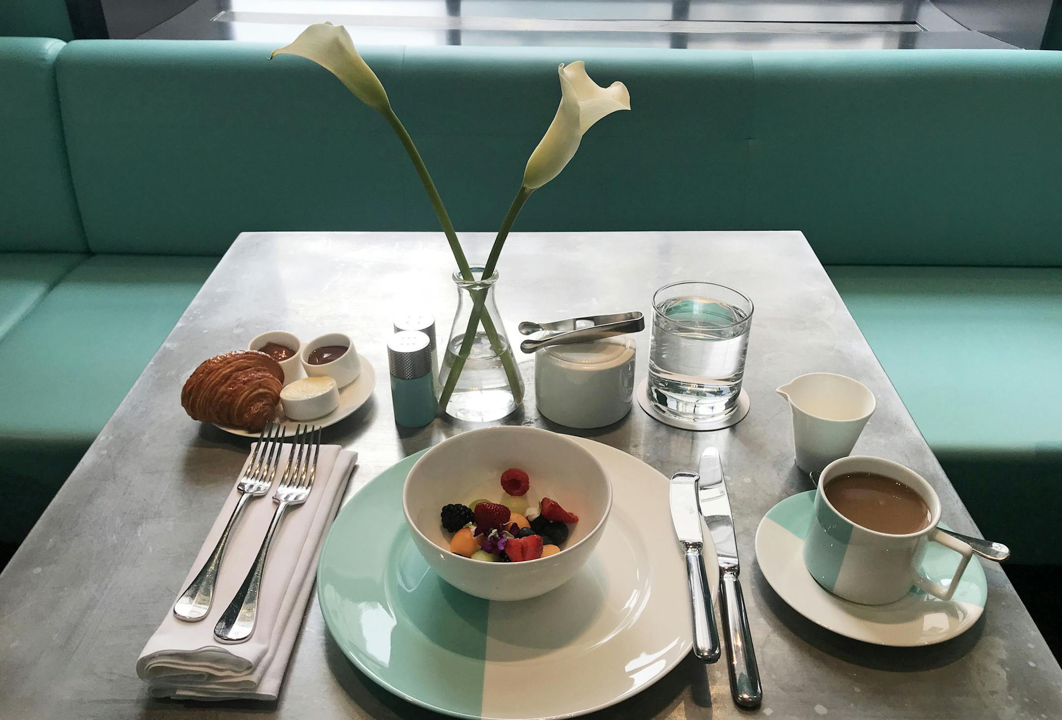 Breakfast at Tiffany includes a choice of coffee or tea, with seasonal fruit and a croissant with honey butter, Nutella and fruit preserves. Guests also have the choice of a smoked salmon and bagel stack, coddled egg, avocado toast or a buttermilk waffle. MUST CREDIT: Photo for The Washington Post by Megan McDonough