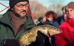 The 20th Annual International Eelpout Festival in Walker, Mn. -- Abe Hiro, senior correspondent for Fuji Television Network News, holds an eelpout for