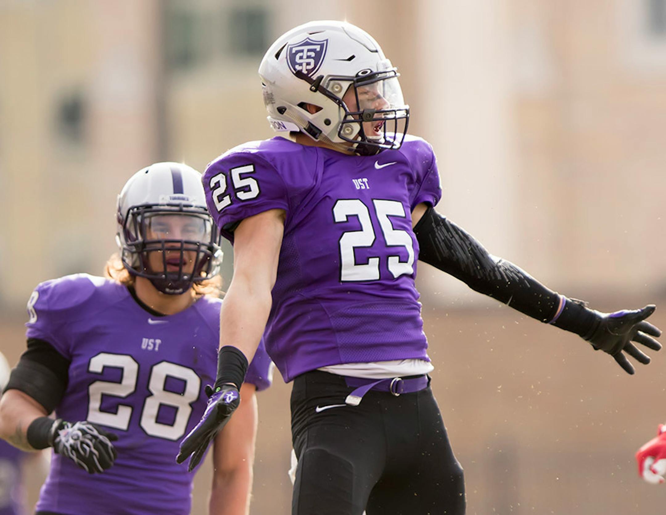St. Thomas defensive back Isaac Seering (25) celebrates after breaking up a screen pass as the University of St. Thomas Tommies hosted the Wabash College Little Giants on December 5, 2015.