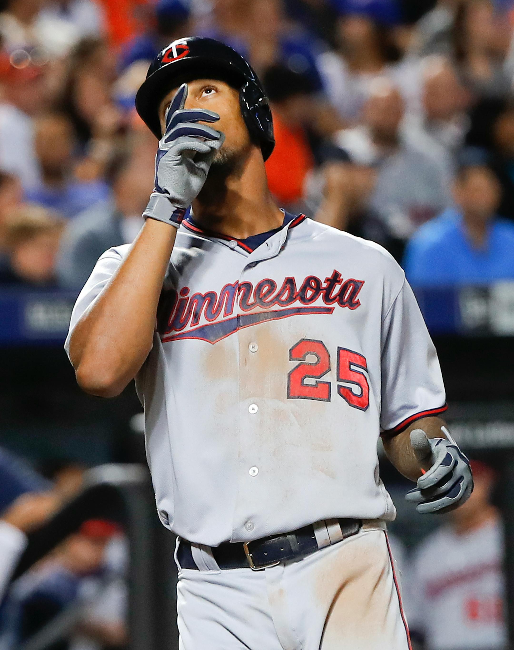 Minnesota Twins center fielder Byron Buxton (25) reacts as he crosses the plate after hitting a solo home run against the New York Mets during the eleventh inning of a baseball game, Saturday, Sept. 17, 2016, in New York. (AP Photo/Julie Jacobson)