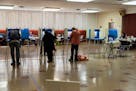 Voters fill out ballots at St. Stephanus Lutheran Church in St. Paul during the 2021 elections.