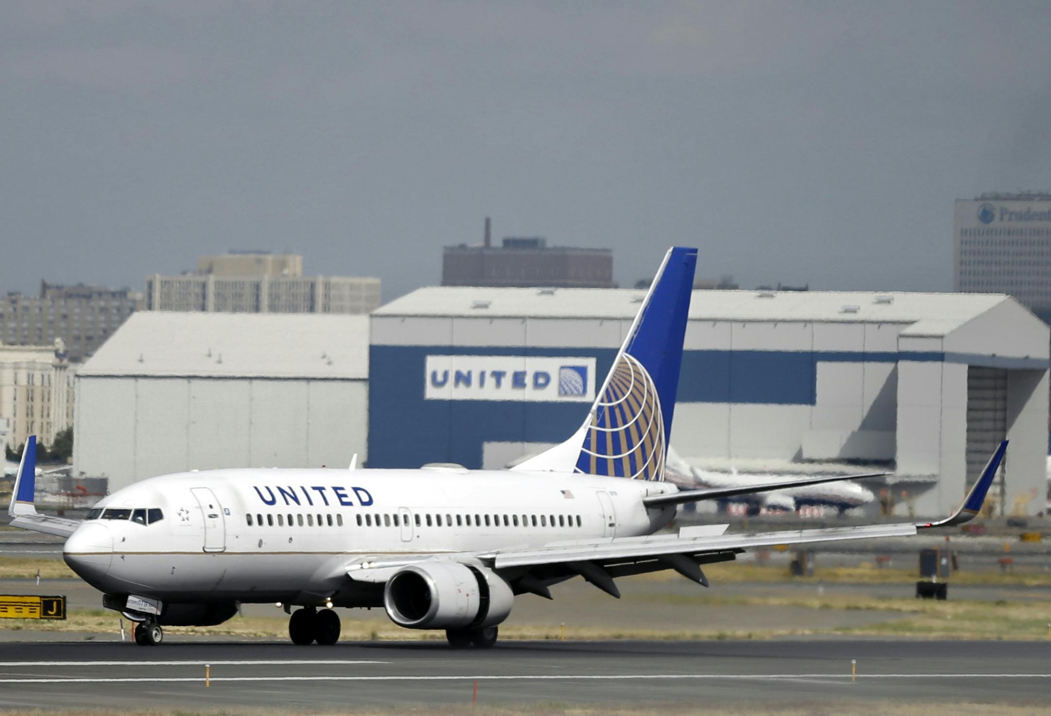 FILE - In this Sept. 8, 2015, file photo, a United Airlines passenger plane lands at Newark Liberty International Airport in Newark, N.J. United said on Monday, March 27, 2017, that regular-paying fliers are welcome to wear leggings aboard its flights, even though two teenage girls were barred by a gate agent from boarding a flight from Denver to Minneapolis Sunday because of their attire. (AP Photo/Mel Evans, File)