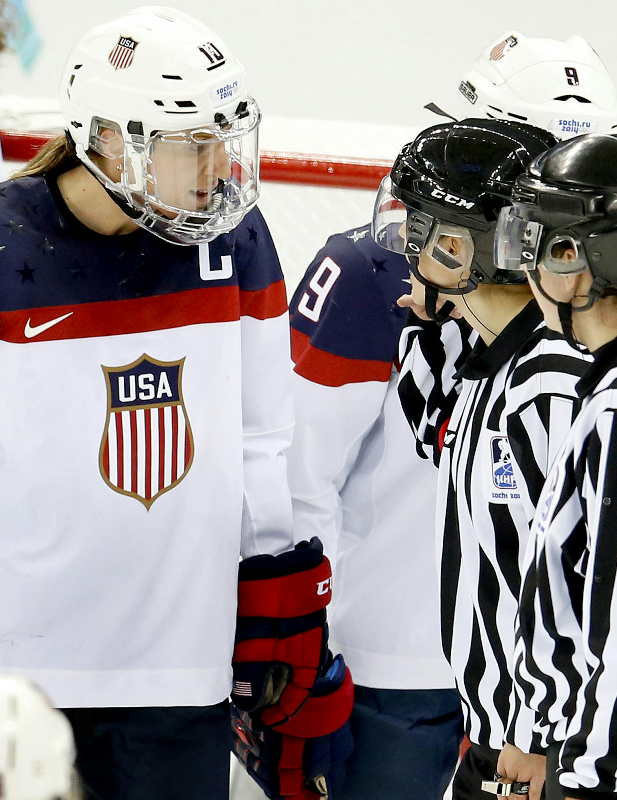 Team USA captain Meghan Duggan (10) spoke to the officials after a goal by Meghan Agosta (2) of Canada in the third period. Canada beat USA by a final score of 3-2. ] CARLOS GONZALEZ cgonzalez@startribune.com - February 12, 2013, Sochi, Russia, Sochi 2014 Winter Olympics, Shayba Arena, Women's Hockey, Team USA vs. Canada