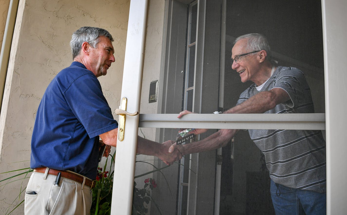 Sen. Minority Leader David Hann talked with Lou Romain while door knocking in his district in Eden Prairie. ] GLEN STUBBE * gstubbe@startribune.com Friday, September 9, 2016 Sen. Minority Leader David Hann was door knocking in his district in Eden Prairie.