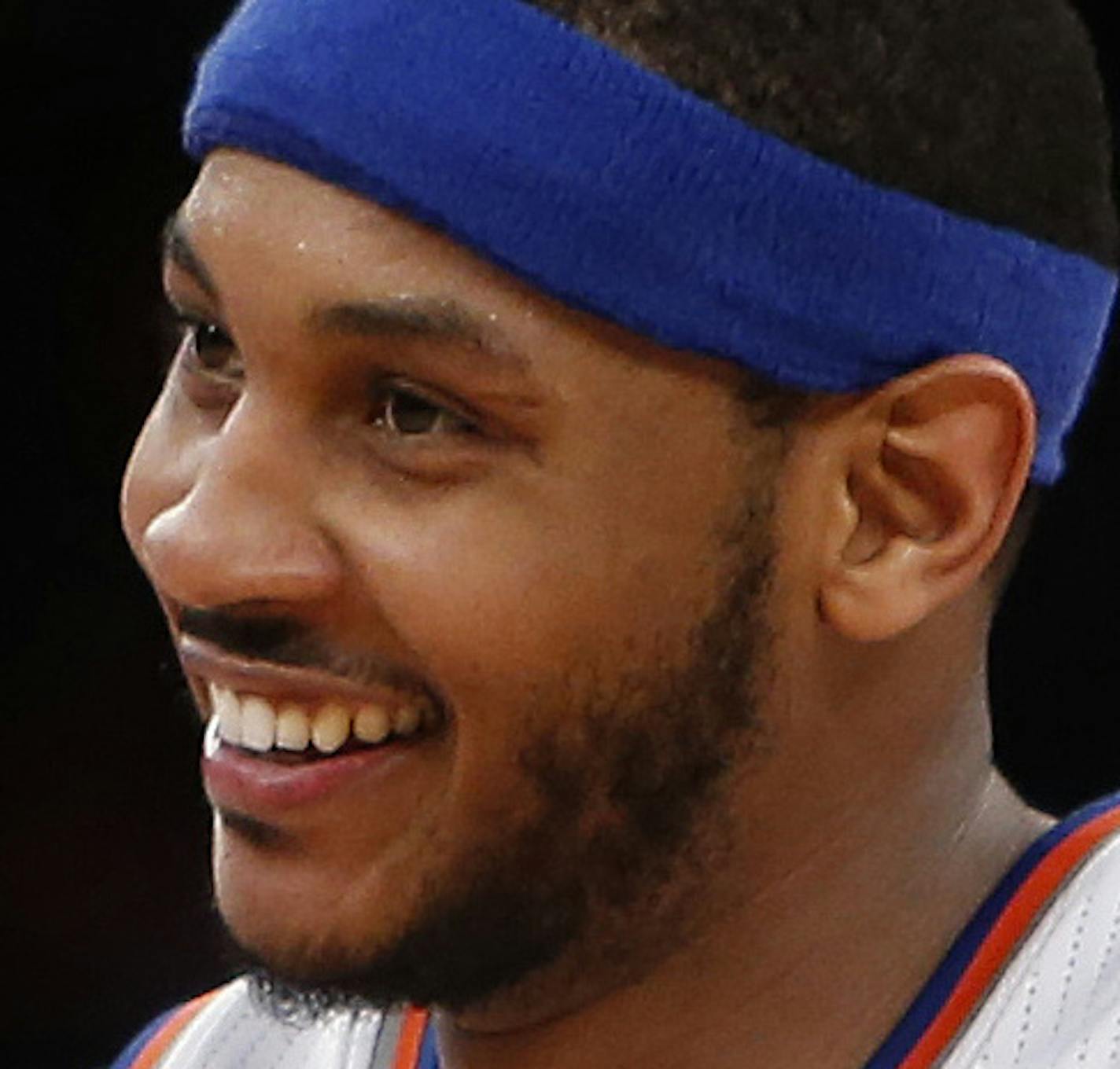 New York Knicks' Carmelo Anthony (7) reacts after hitting a 3-point shot against the Dallas Mavericks during the second half of an NBA basketball game Monday, Feb. 24, 2014, in New York. Dallas won 110-108. (AP Photo/Jason DeCrow)