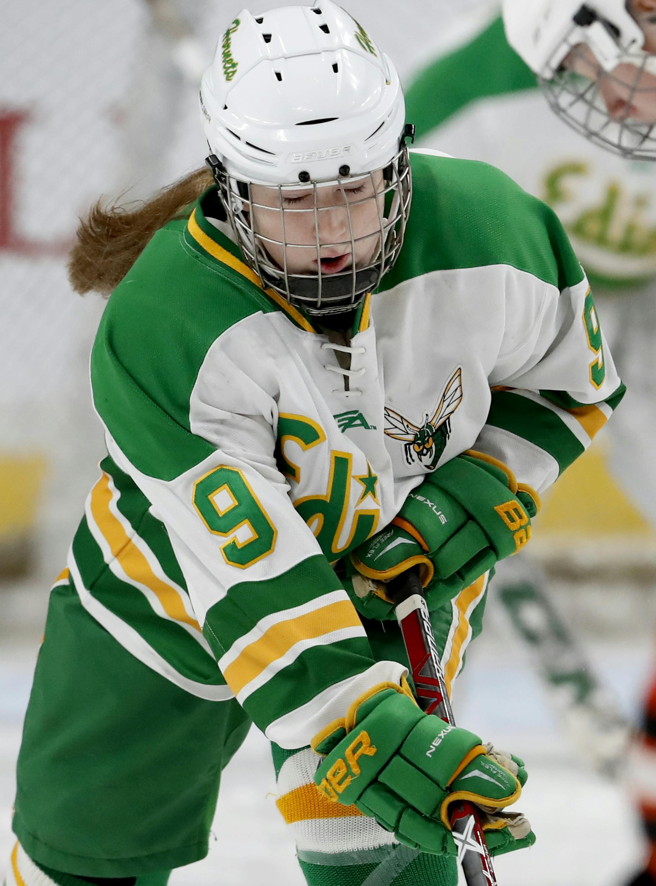 Olivia Kilberg (9) of Edina tried to make her way past Farmington defenders in the first period. ] CARLOS GONZALEZ • cgonzalez@startribune.com - February 23, 2017, St. Paul, MN, Xcel Energy Center, High School / Prep Girls Hockey State Tournament, Farmington vs. Edina