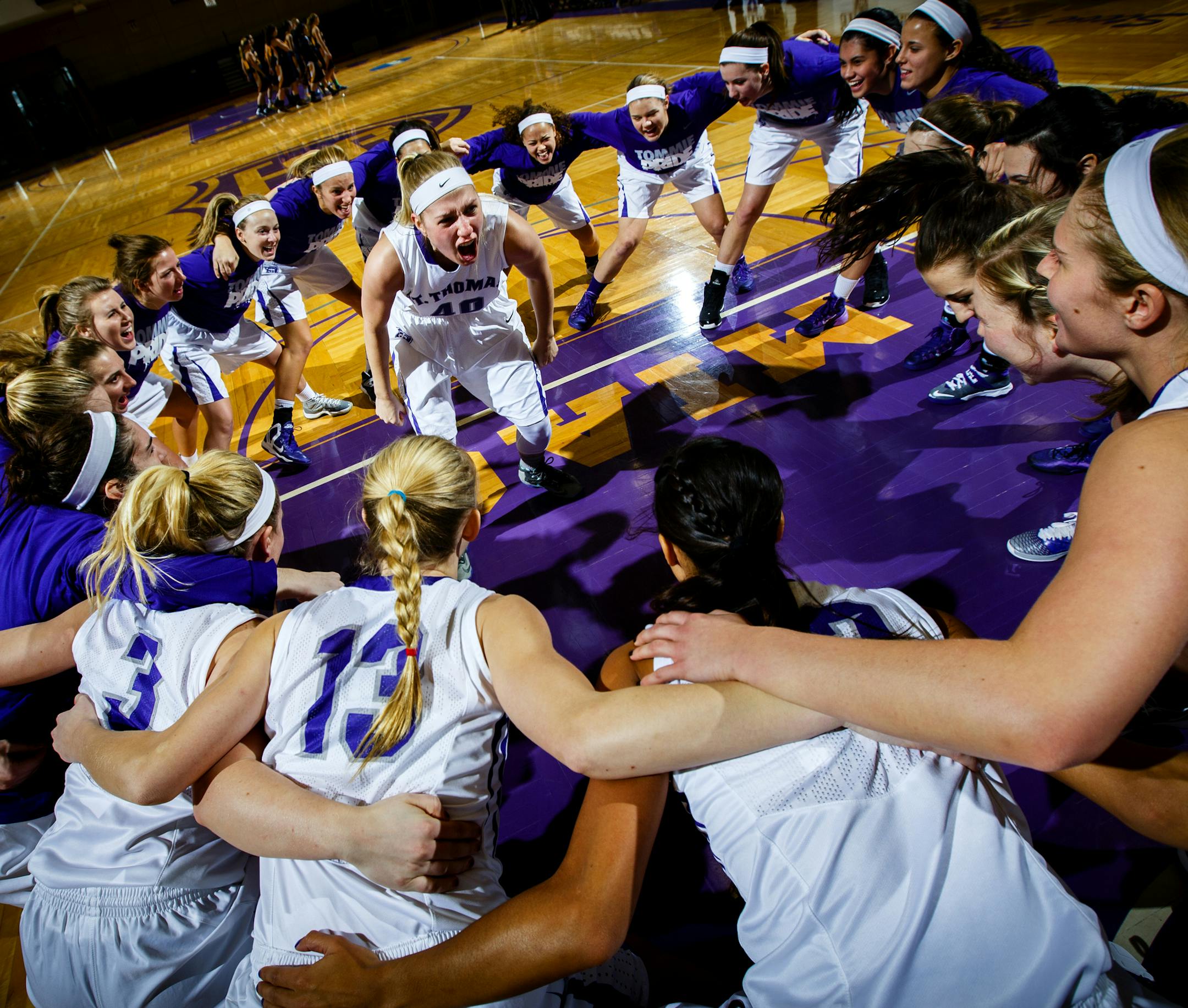 Maggie Weiers fires up the team January 4, 2014 before a women's basketball game against Carleton College in Schoenecker Arena. The Tommies won 100-46.