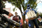 Edward Barlow, a music teacher at Anwatin Middle School in Minneapolis, played the drums during Wednesday's rally. "What we're doing is not sustainabl